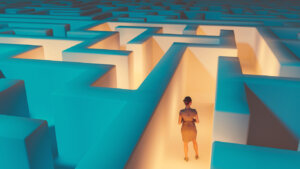 Woman stands in the middle of maze- finding her way with clues is progressive disclosure.jpg