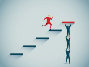 UX maturity model staircase man leaps to the top while team lifts him up