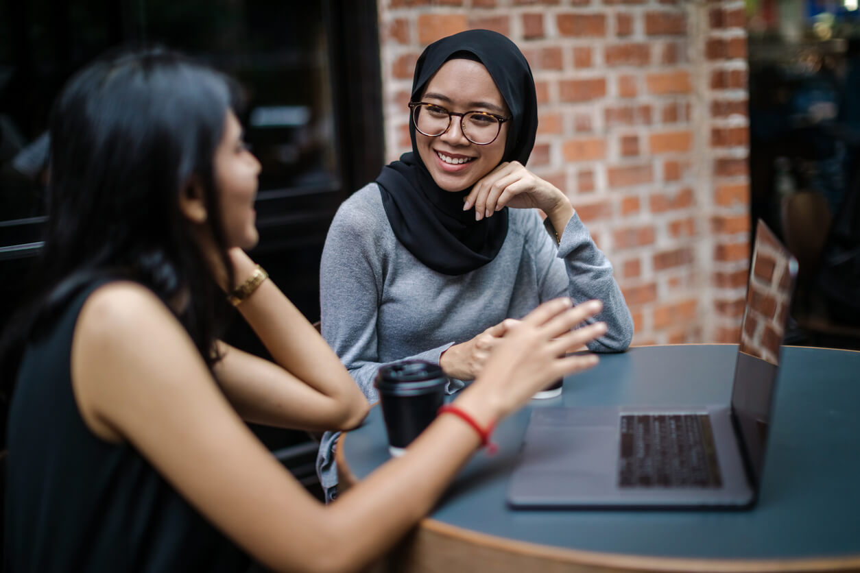 Ethnography training- two asian women listen to each other in an interview