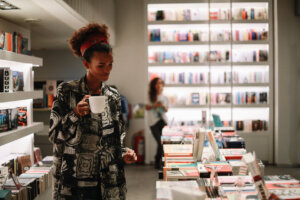 Young black woman in a bookstore cafe