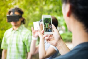 Group of friends having fun with Virtual Reality Consoles