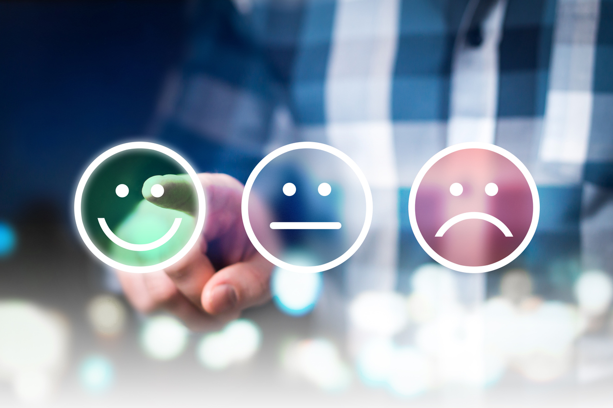 Business man giving rating and review with happy, neutral or sad face icons. Customer satisfaction and service quality survey.