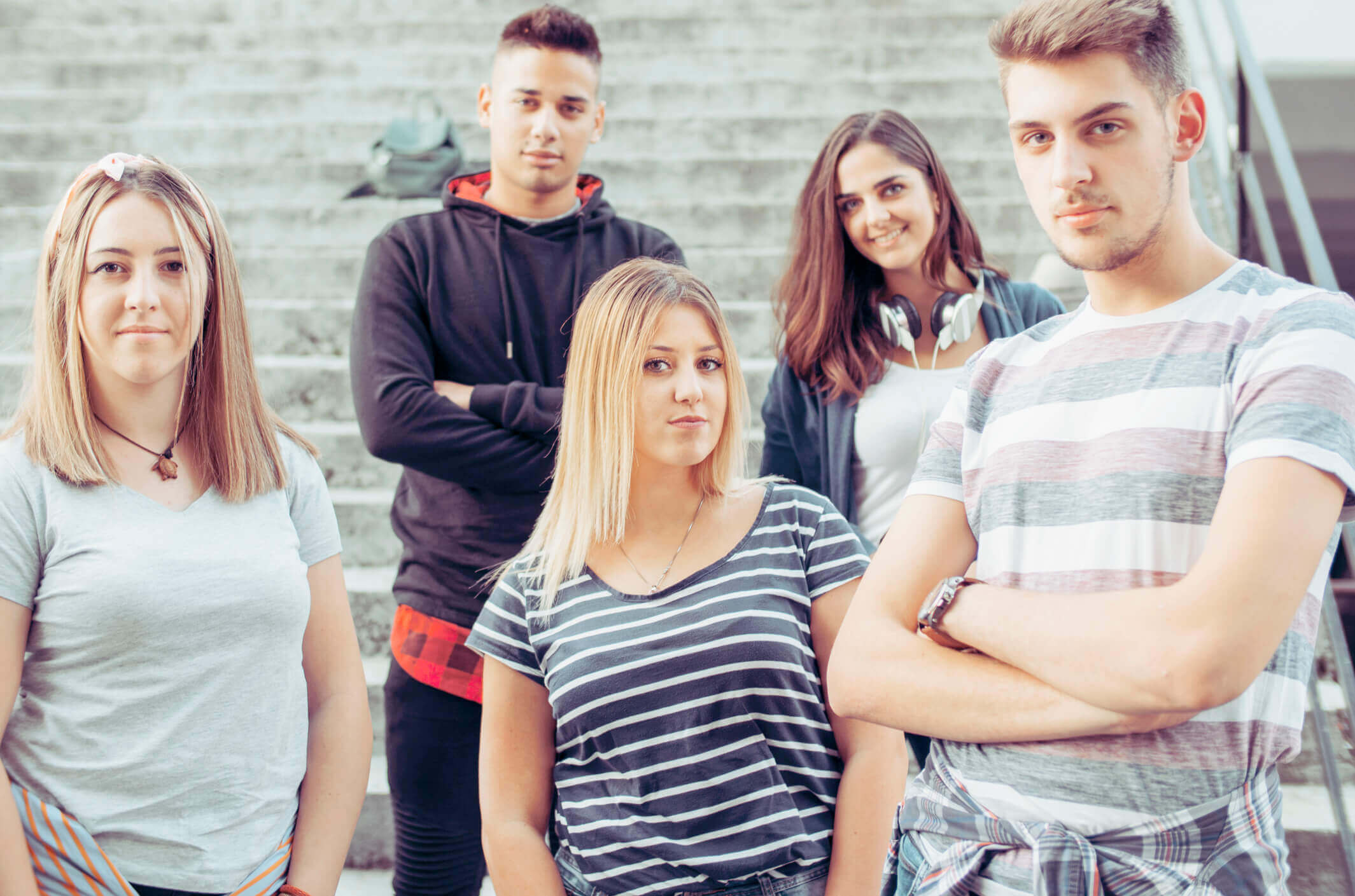 Urban style young people with colorful fashionable clothes posing