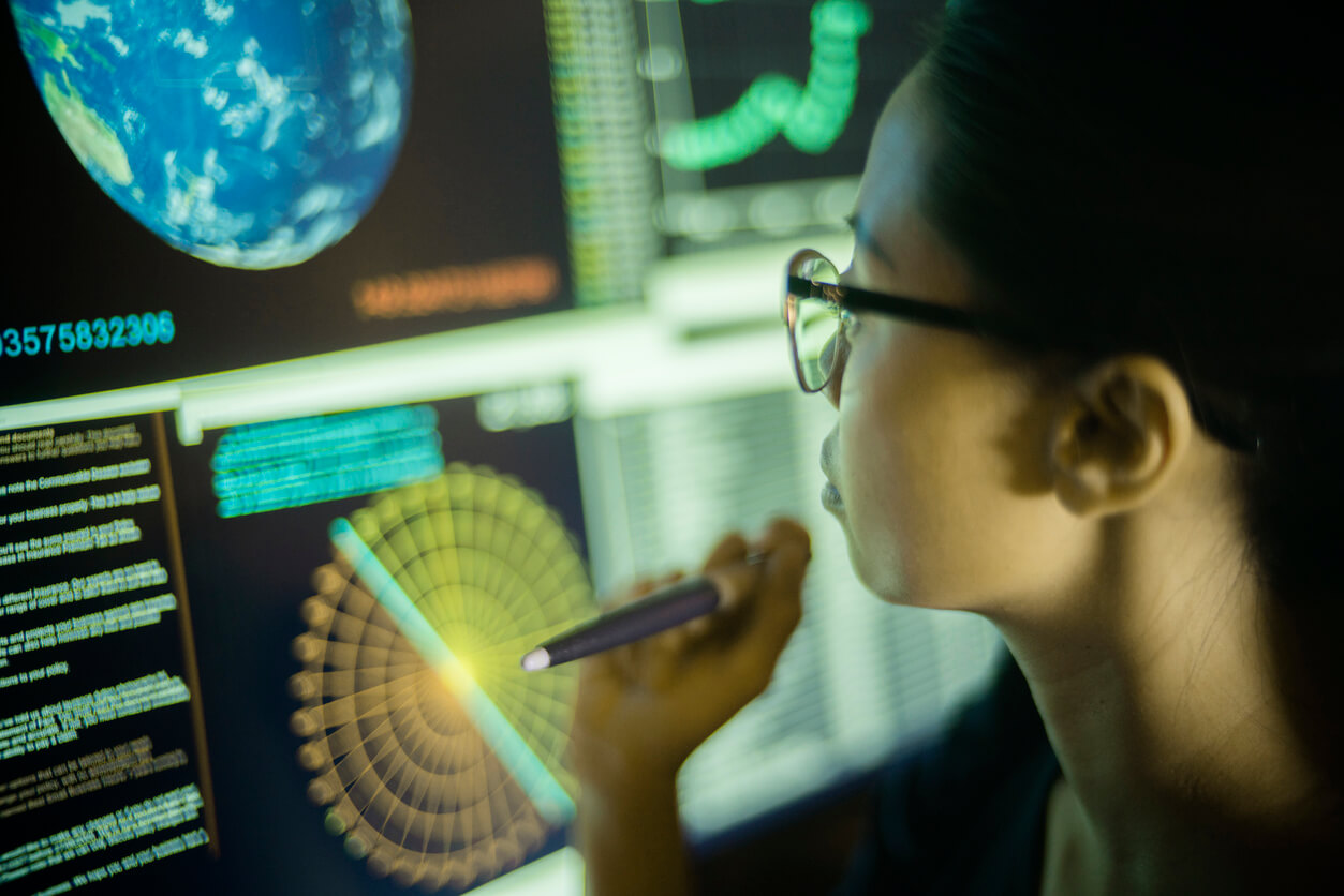 asian woman reviews ecosystem data for UX