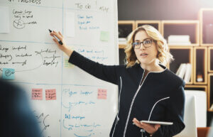 design manager plays vital role presenting at whiteboard