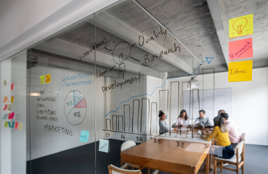 UX coaching team meeting in a distant design room