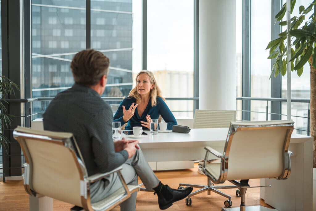 UX mentoring- white woman speaks to a white man