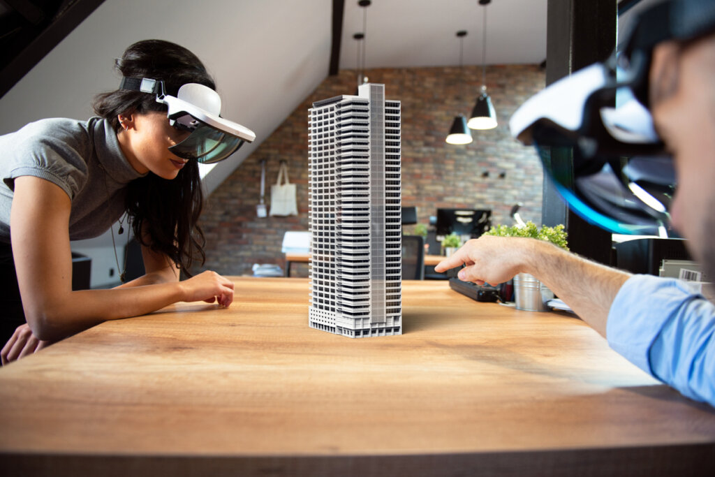 AR/VR UX design workshop participants explore a hologram