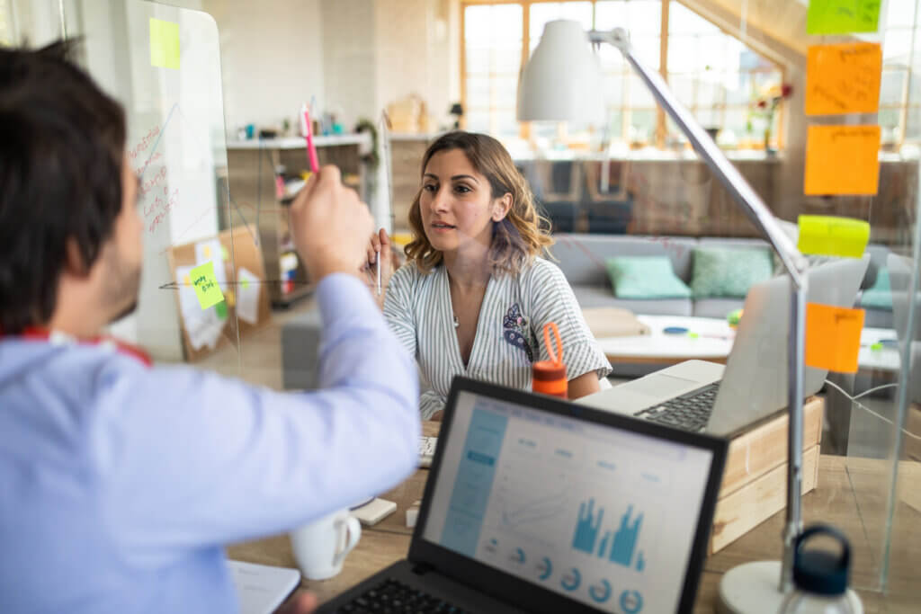 two colleagues discuss UX Research vs Market Research pros and cons