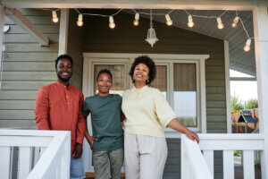 Black Family Posing at New House