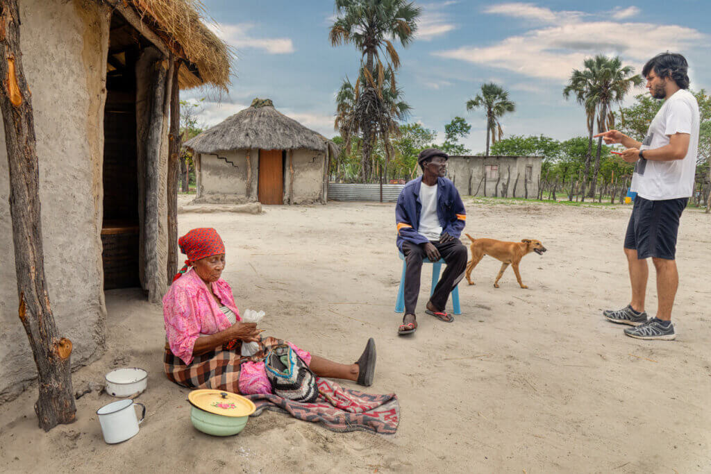 african villagers interviewed by white male ux researcher.jpg